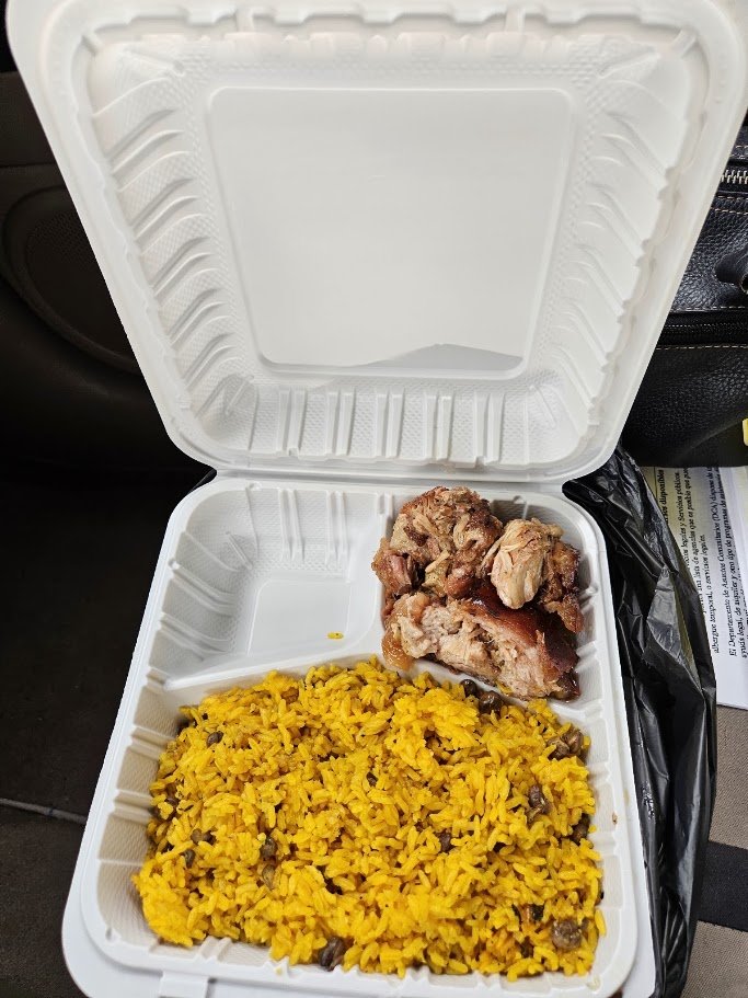 Plates of rice, beans, and roast pork